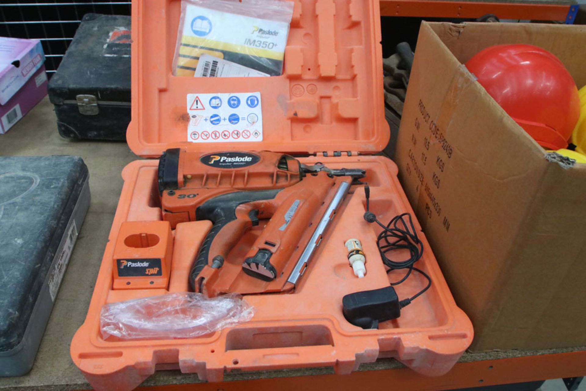 Paslode Impulse IM350 nail gun with charger and battery