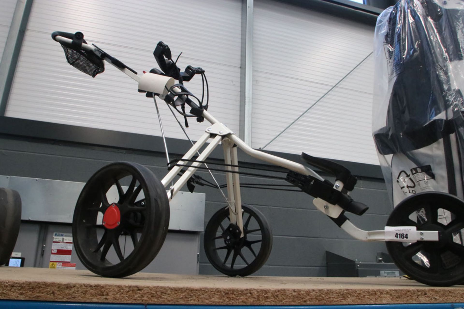 White fold up golf trolley