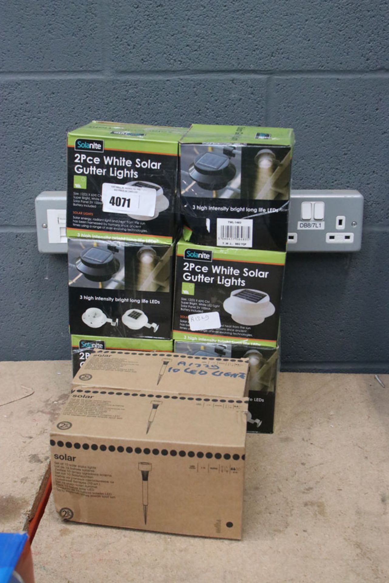 2 boxes of small LED solar lights and 6 gutter lights