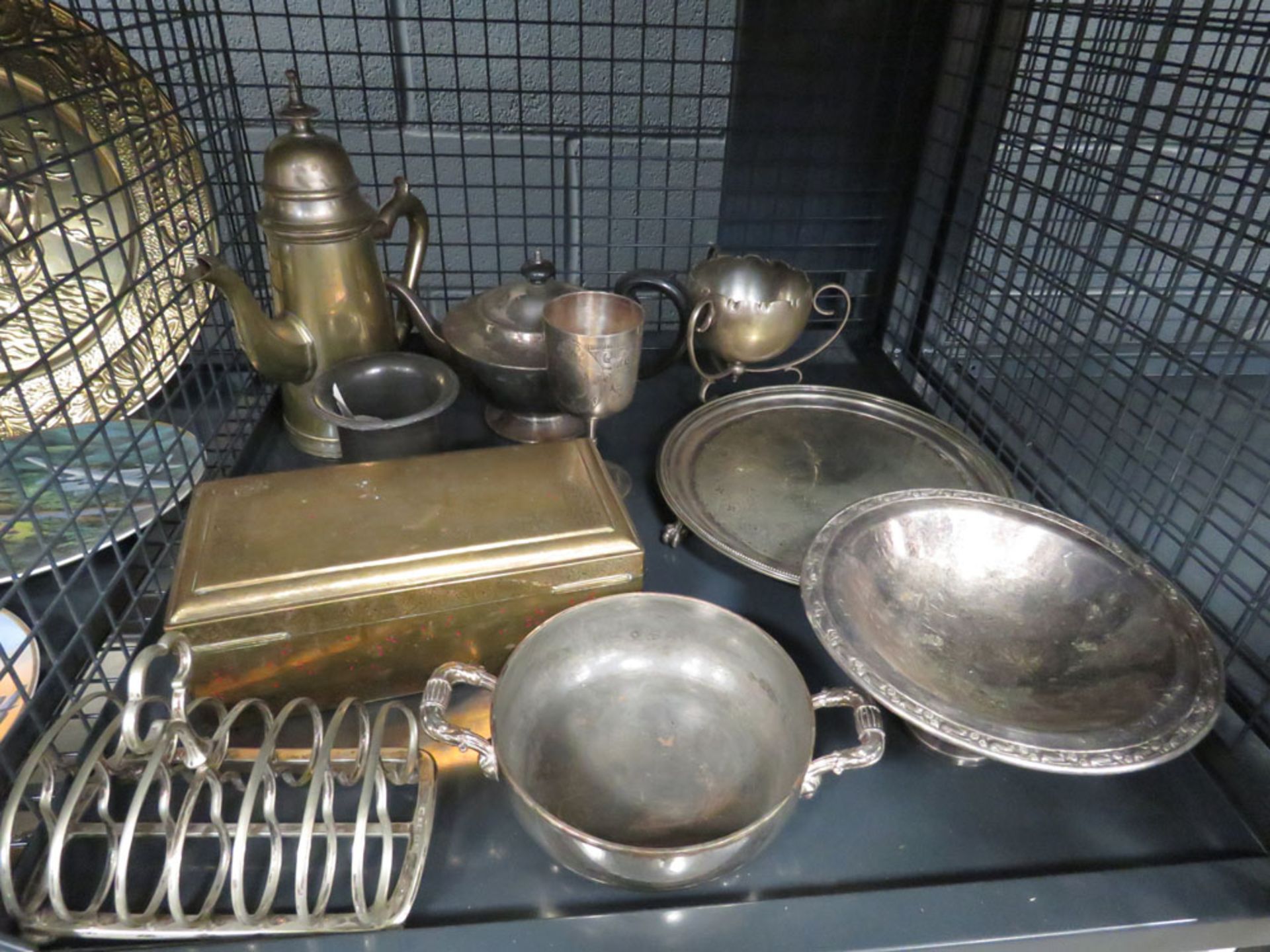 Cage containing silver plate to include a toast rack, hot water jug, teapot, trays and bowls