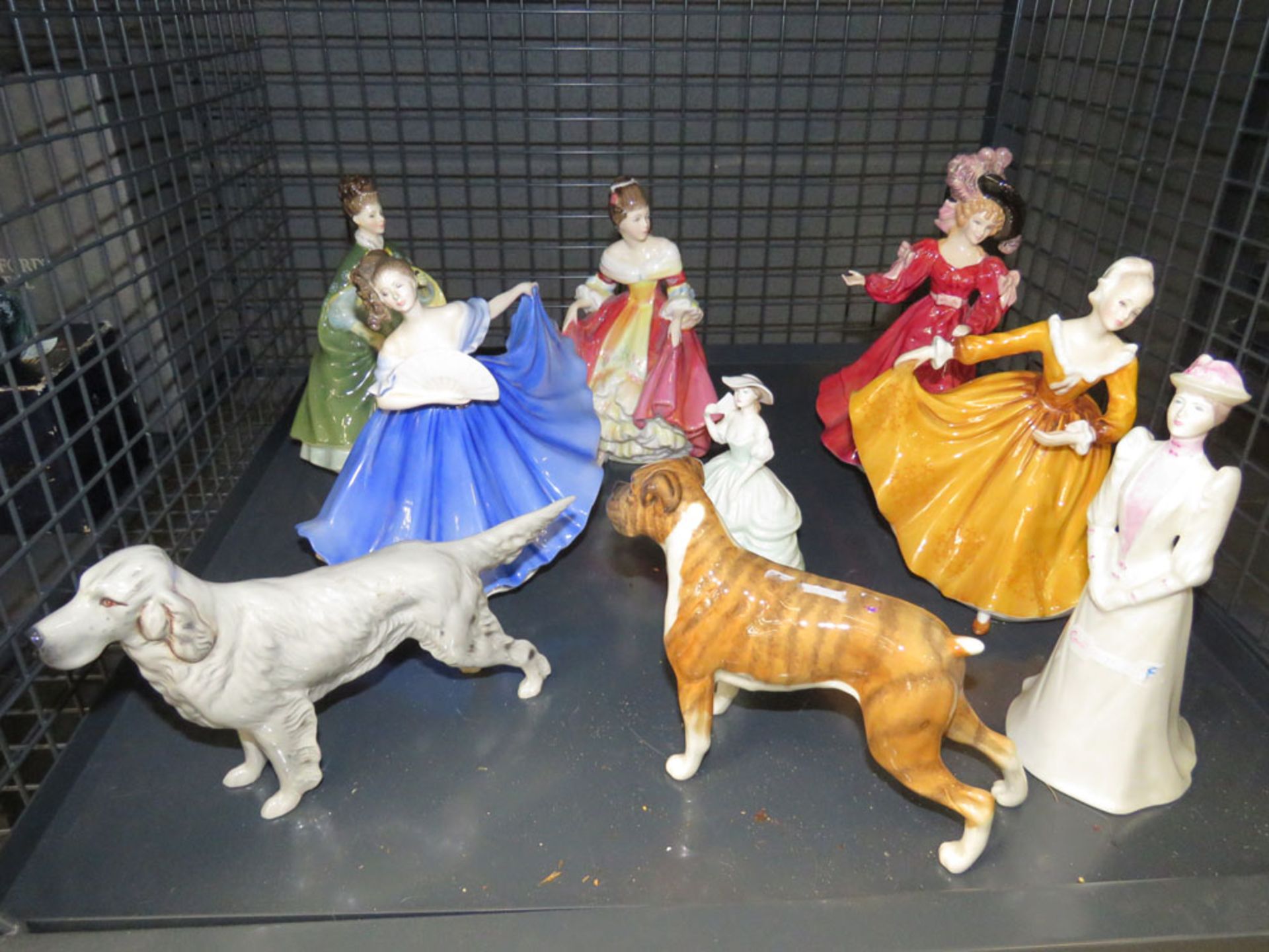 Cage containing Royal Doulton and Coalport lady figures plus 2 figures of dogs