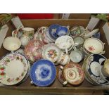 Box containing a large quantity of floral patterned cups and saucers