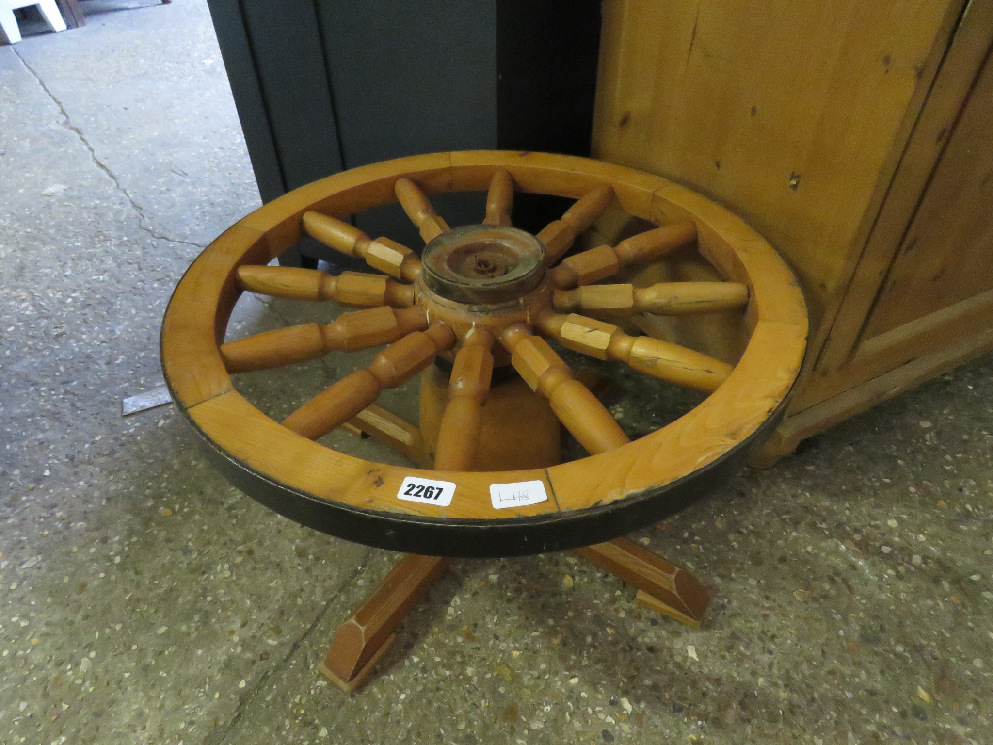 Small table in the form of a ship's wheel