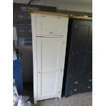 (10) Off-white single door pantry cupboard with fitted light oak interior and oak trim (lacking