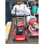 Homelite petrol lawn mower (no grass box) with red plastic jerry can