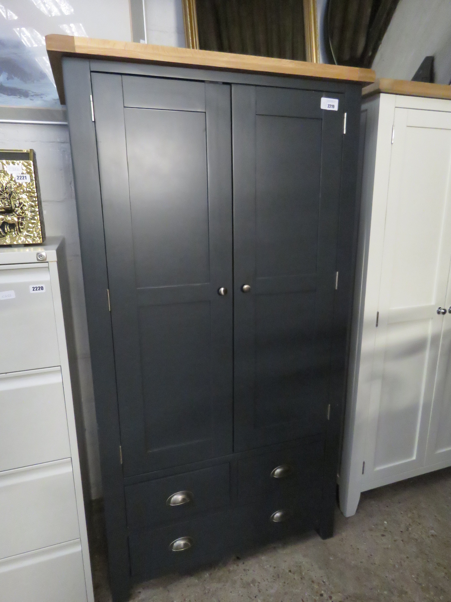 (12) Dark blue pantry cupboard with light oak fitted interior and oak top