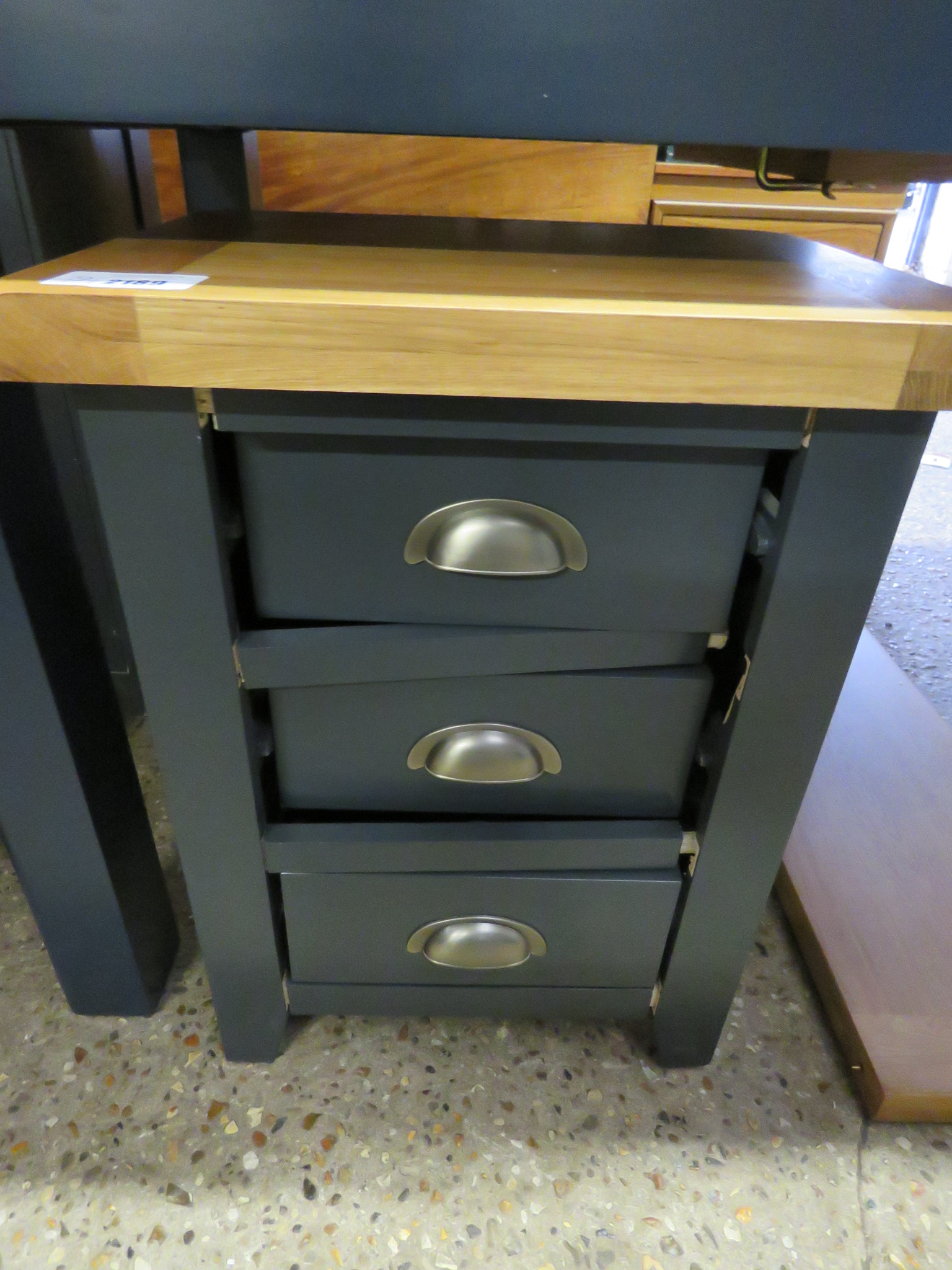 (12) Badly damaged dark blue 3 drawer bedside with oak surface for parts