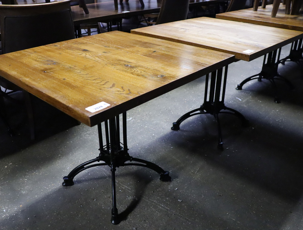 Two dark oak topped bar tables on ornate black wrought metal four star supports 800 x 800