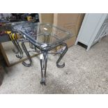 Wrought metal occasional table with glass surface