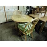 Beech circular kitchen table and 2 spindle back chairs