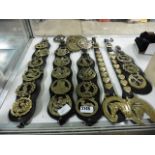 Quantity of horse brasses on leather