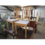 Pair of light oak framed dining chairs with white upholstered seats