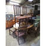 Circular drop leaf dining table with 6 various oak framed dining chairs