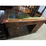 Mahogany twin pedestal desk with green leather surface