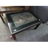 Low level glass top coffee table with inset map of the known world