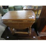 Dark oak small occasional table with drop sides