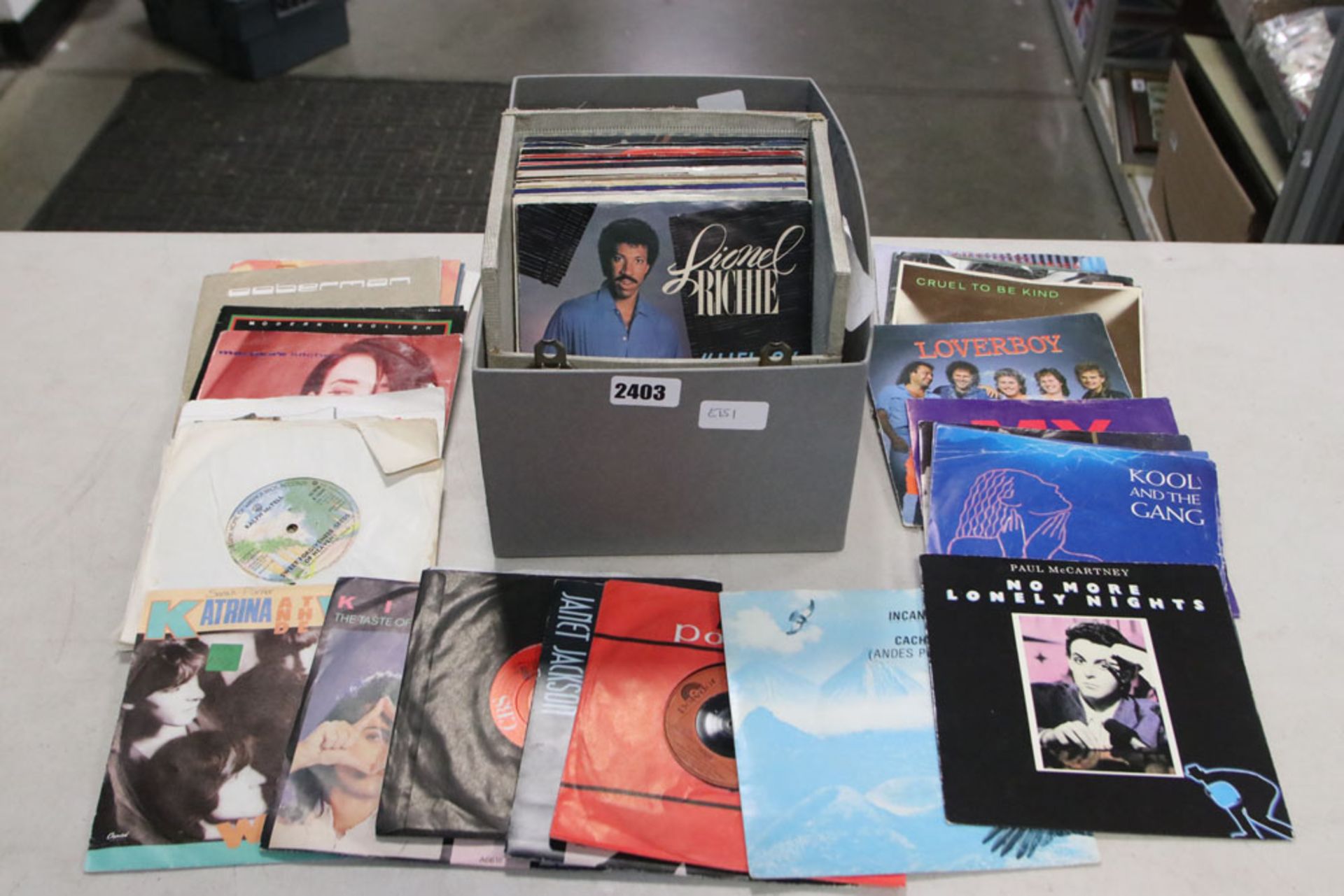 Tray containing various 7'' singles to include Lionel Richie