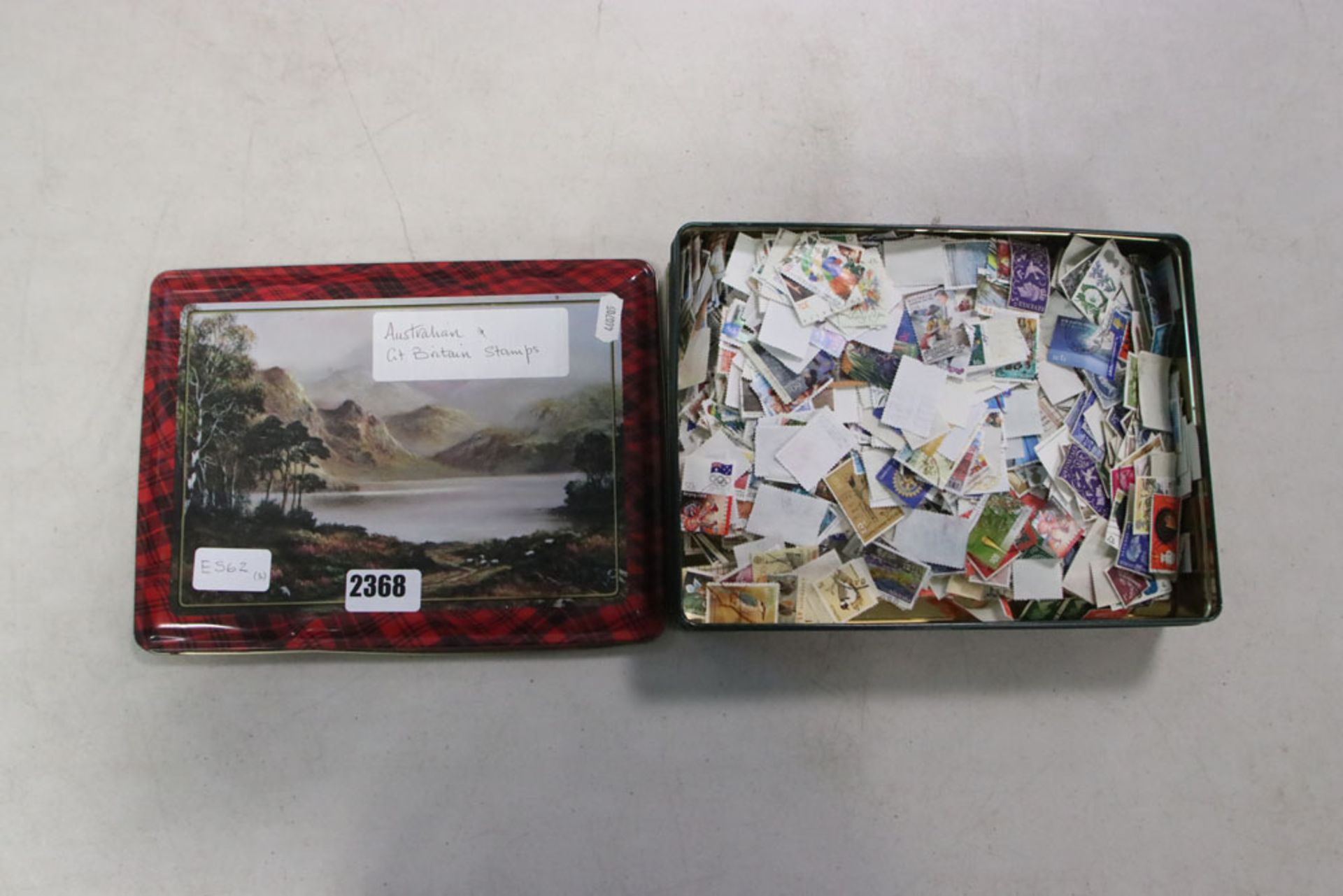 Tin of Australian and GB stamps