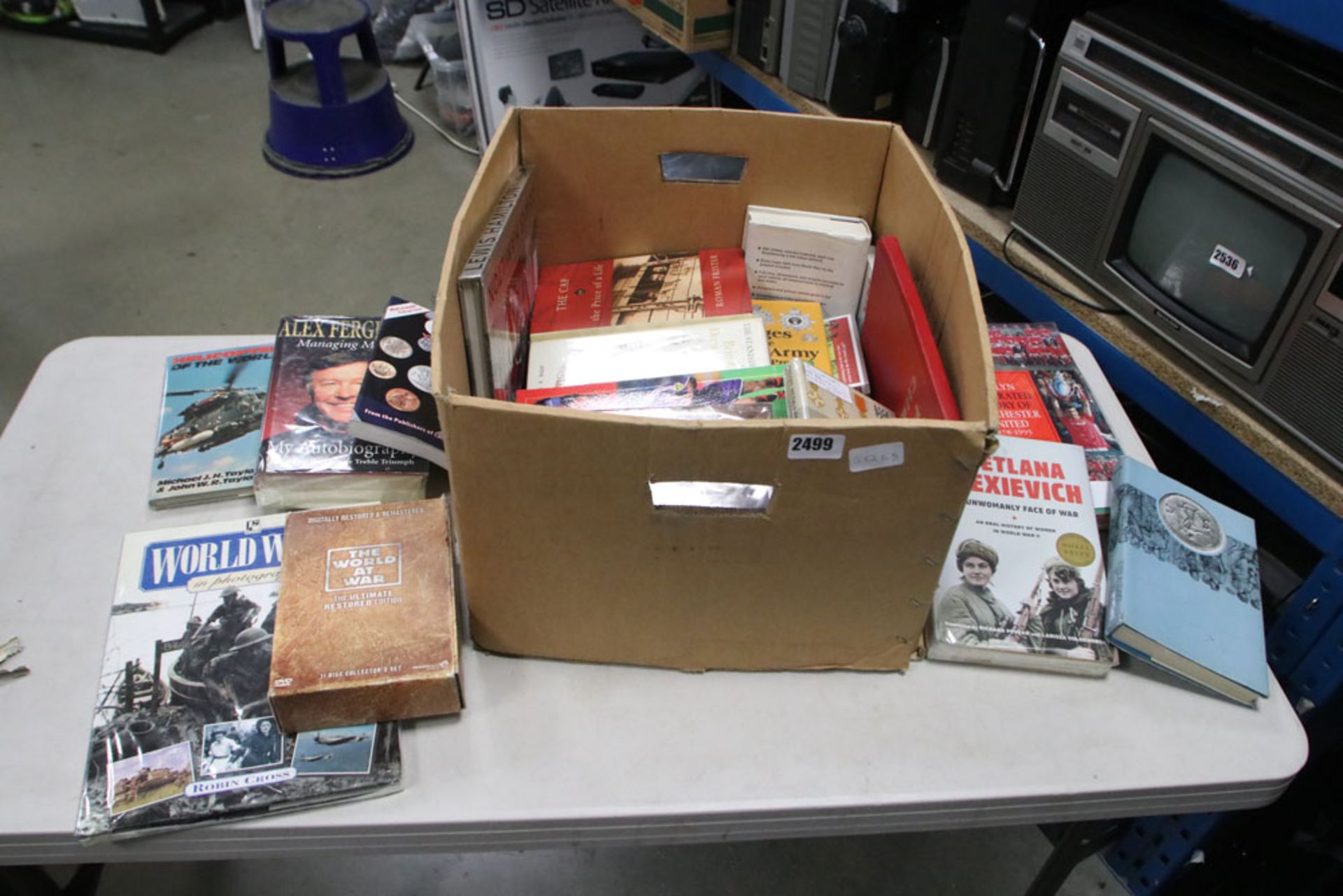 Tray of various books, coin books, football annuals, etc.