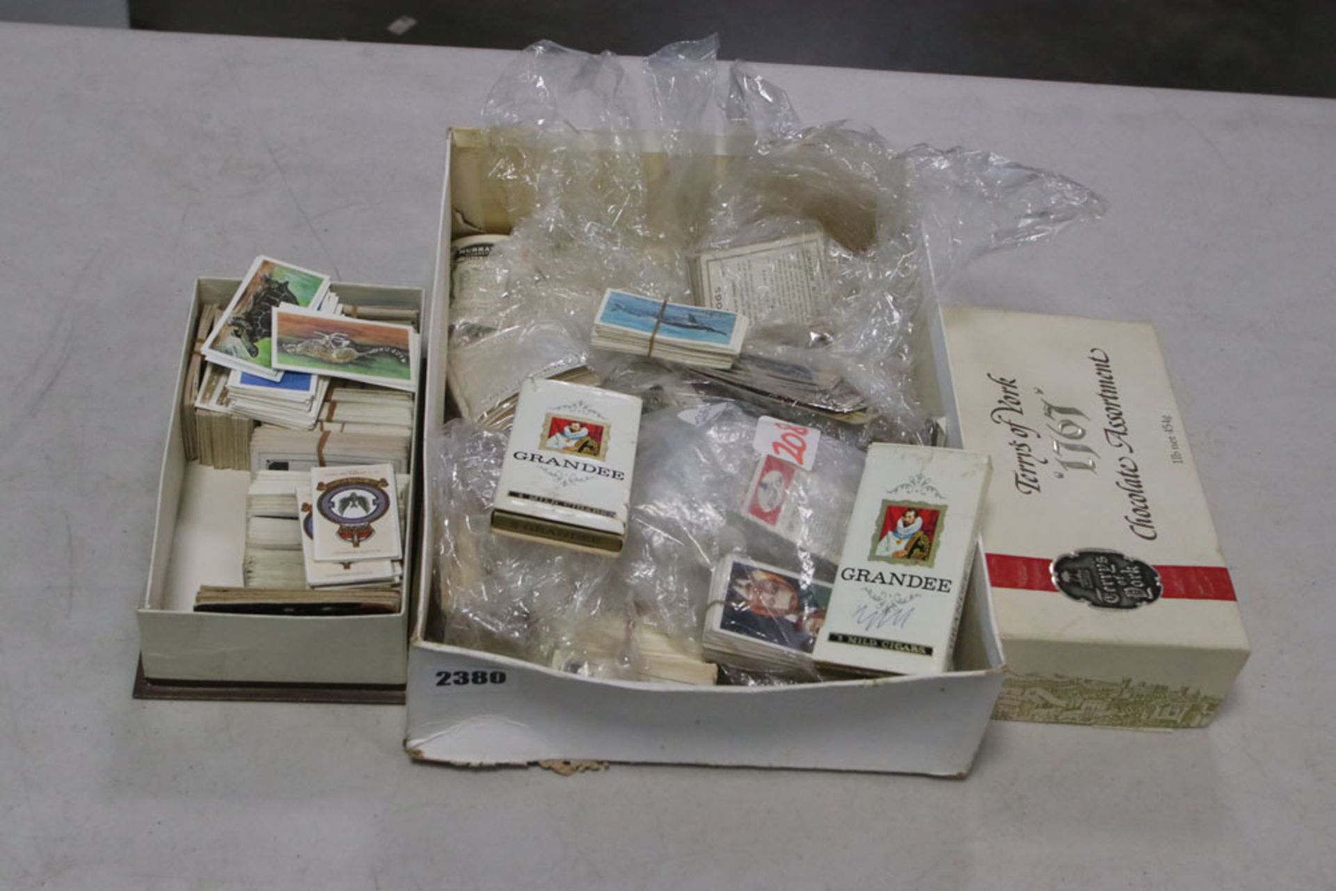 Box containing loose cigarette cards