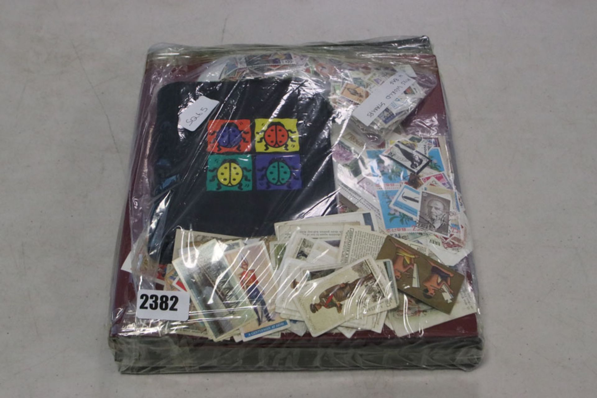Package containing various stamps, stock book albums, tea cards etc.