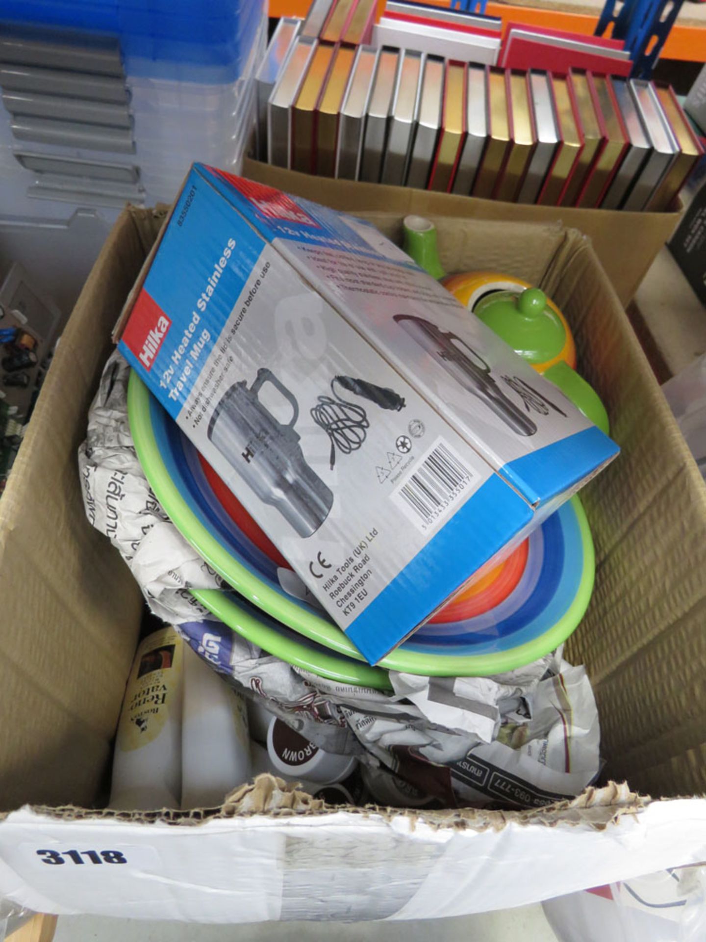 Box containing travel mug, various plates, etc