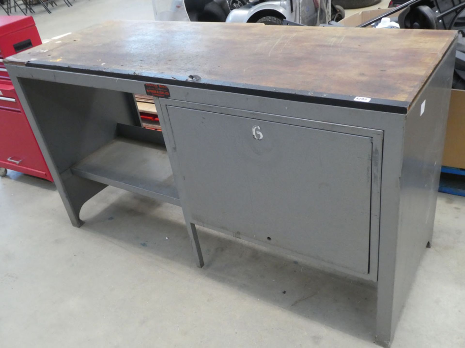 Metal tool bench with cupboard under