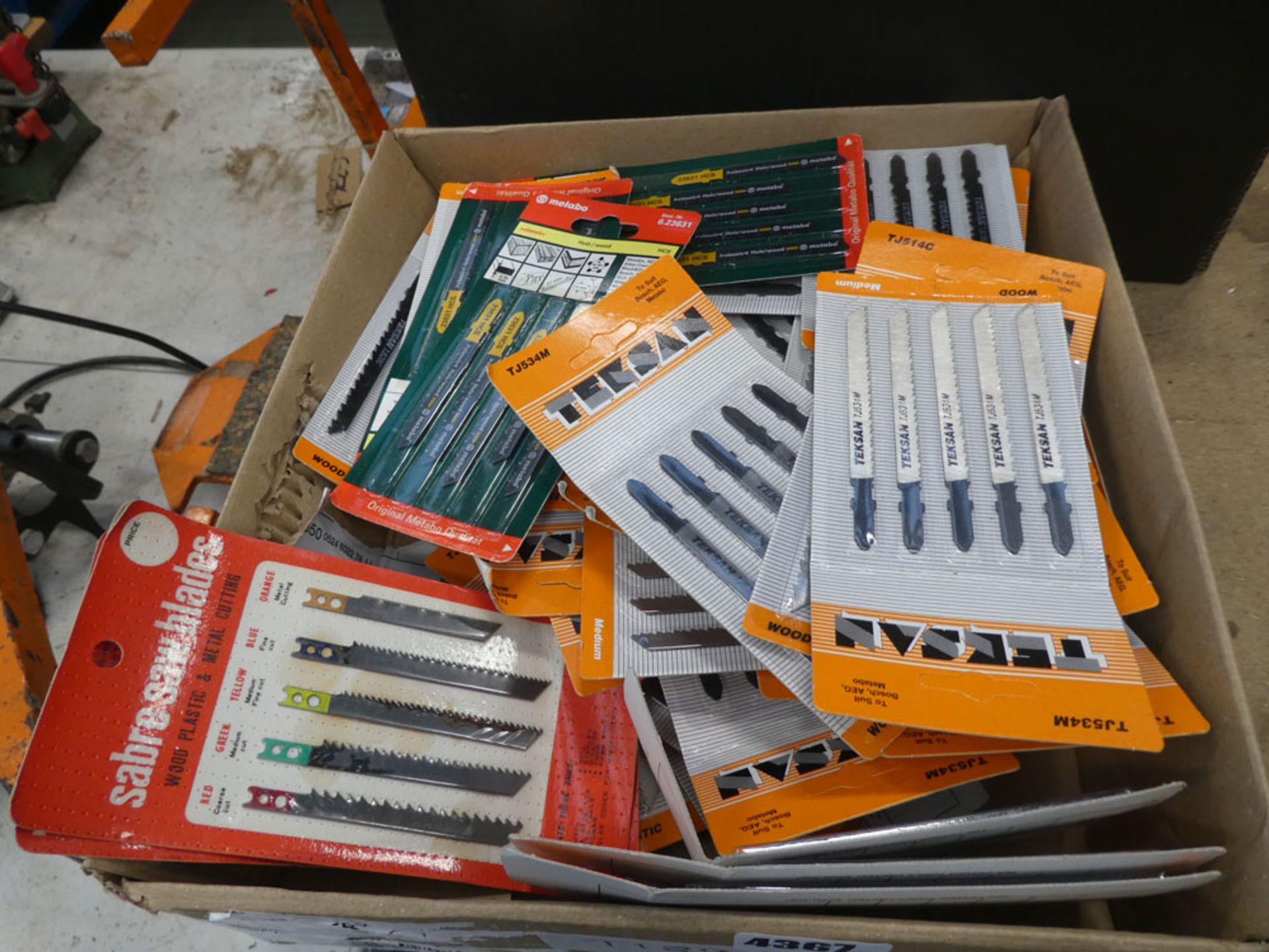 Box of various jigsaw blades