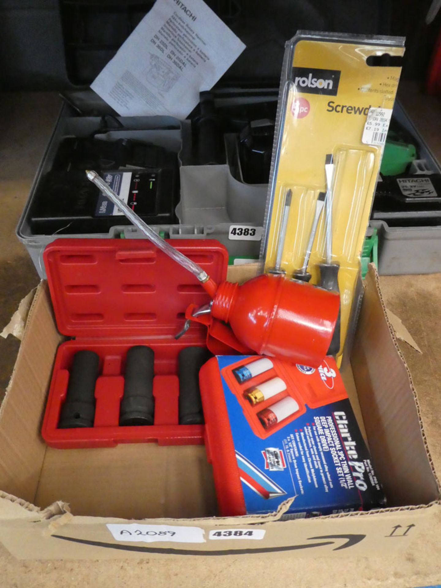 Box containing deep impact sockets, screwdrivers, and Clarke impact drive set