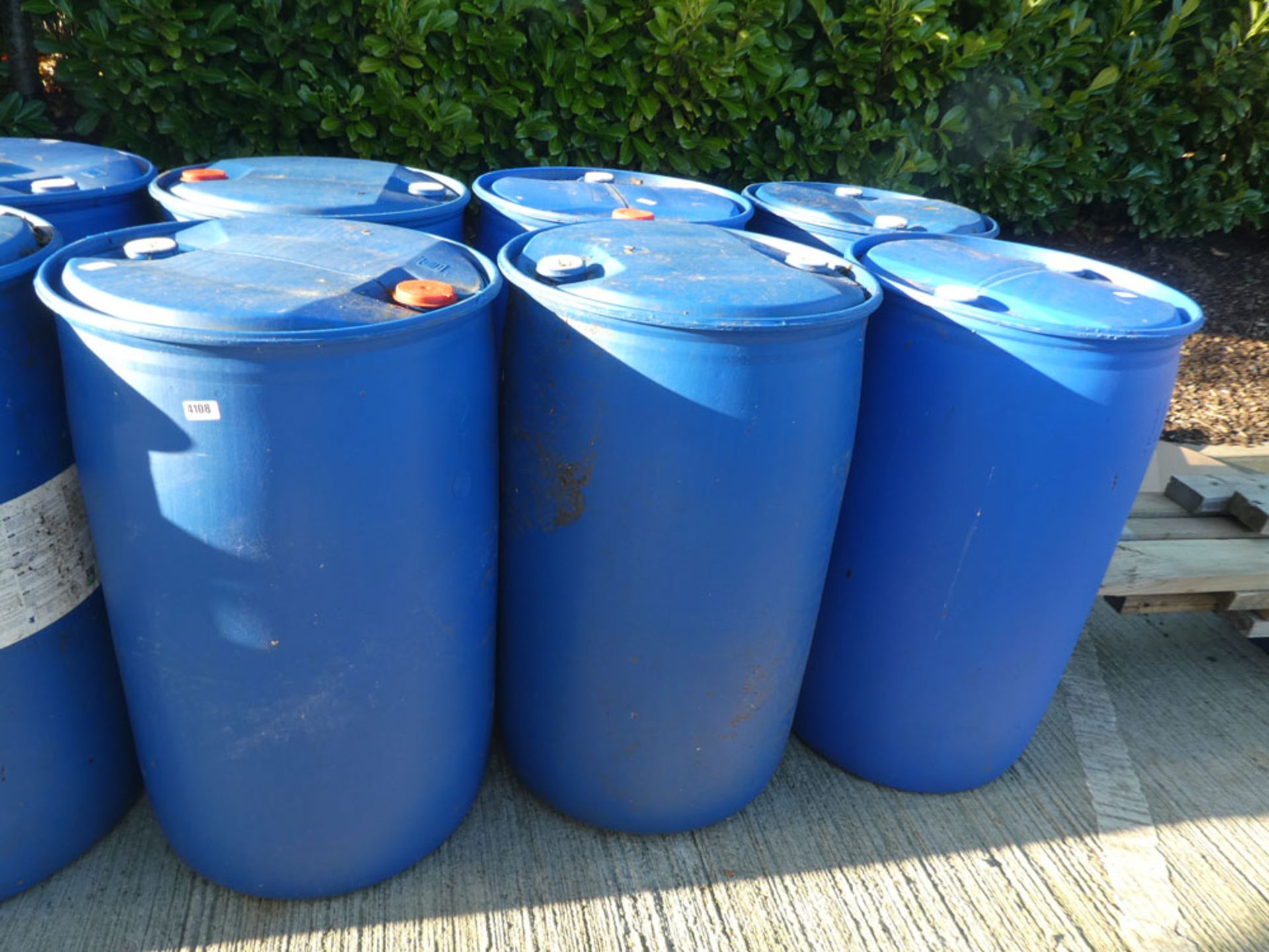 6 plastic storage barrels