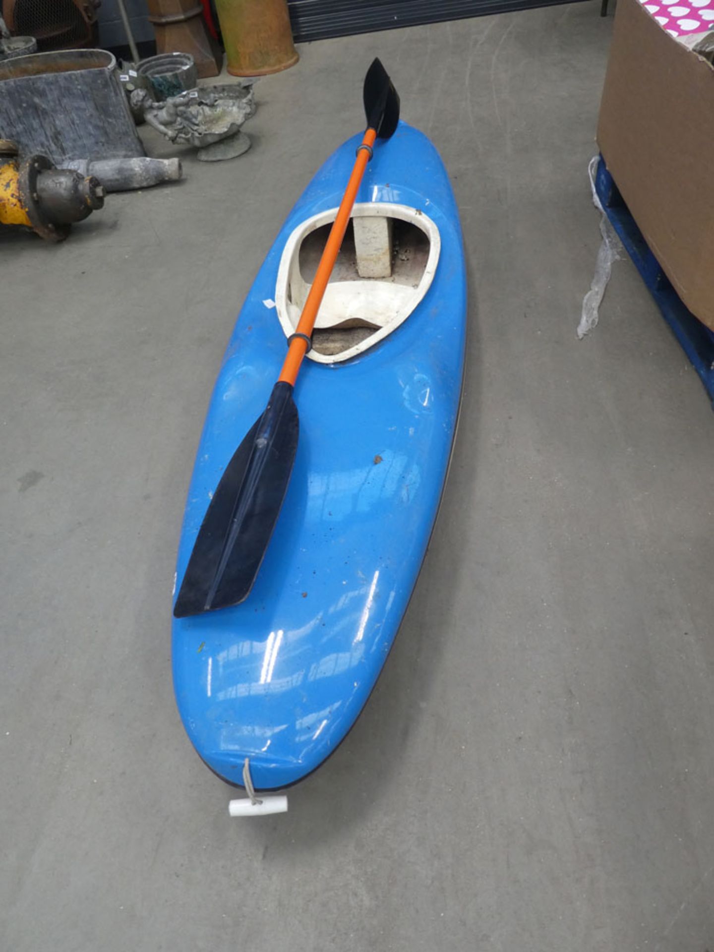 Small canoe and paddle