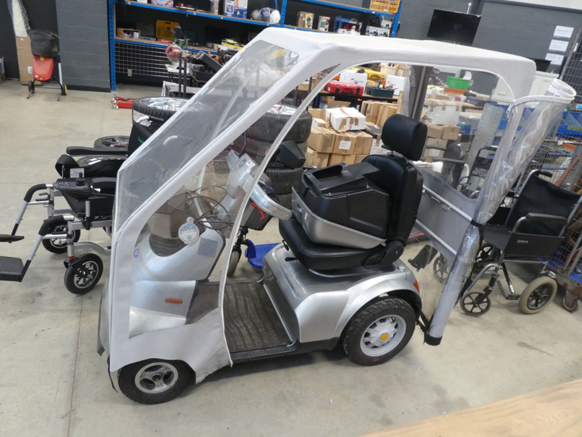 TGA large 4-wheel mobility scooter with canopy, logbook, back box, keys and charger