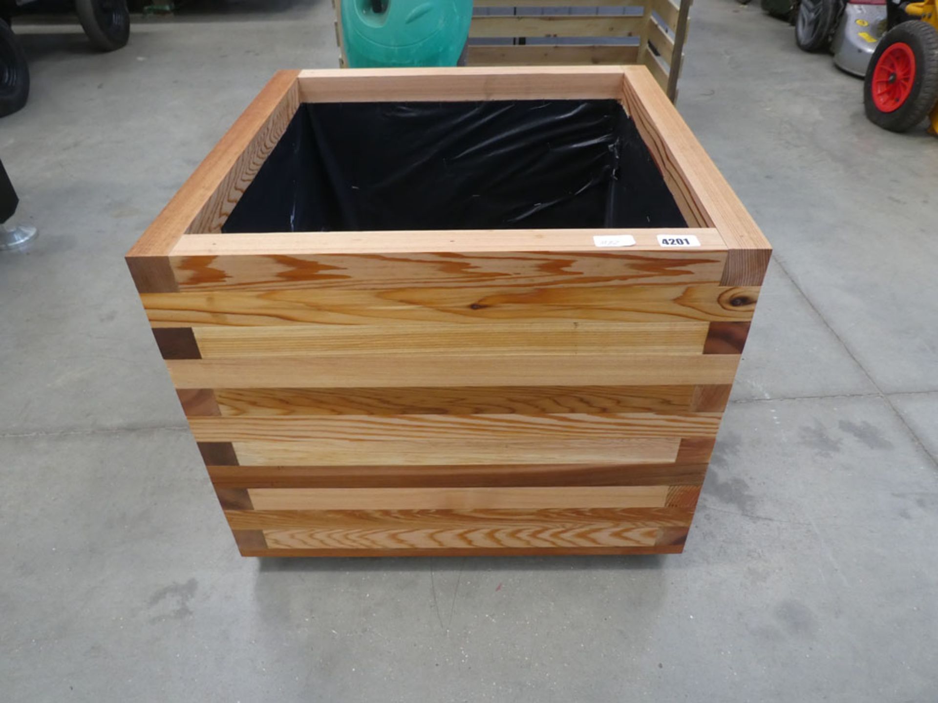 Wooden lined garden planter