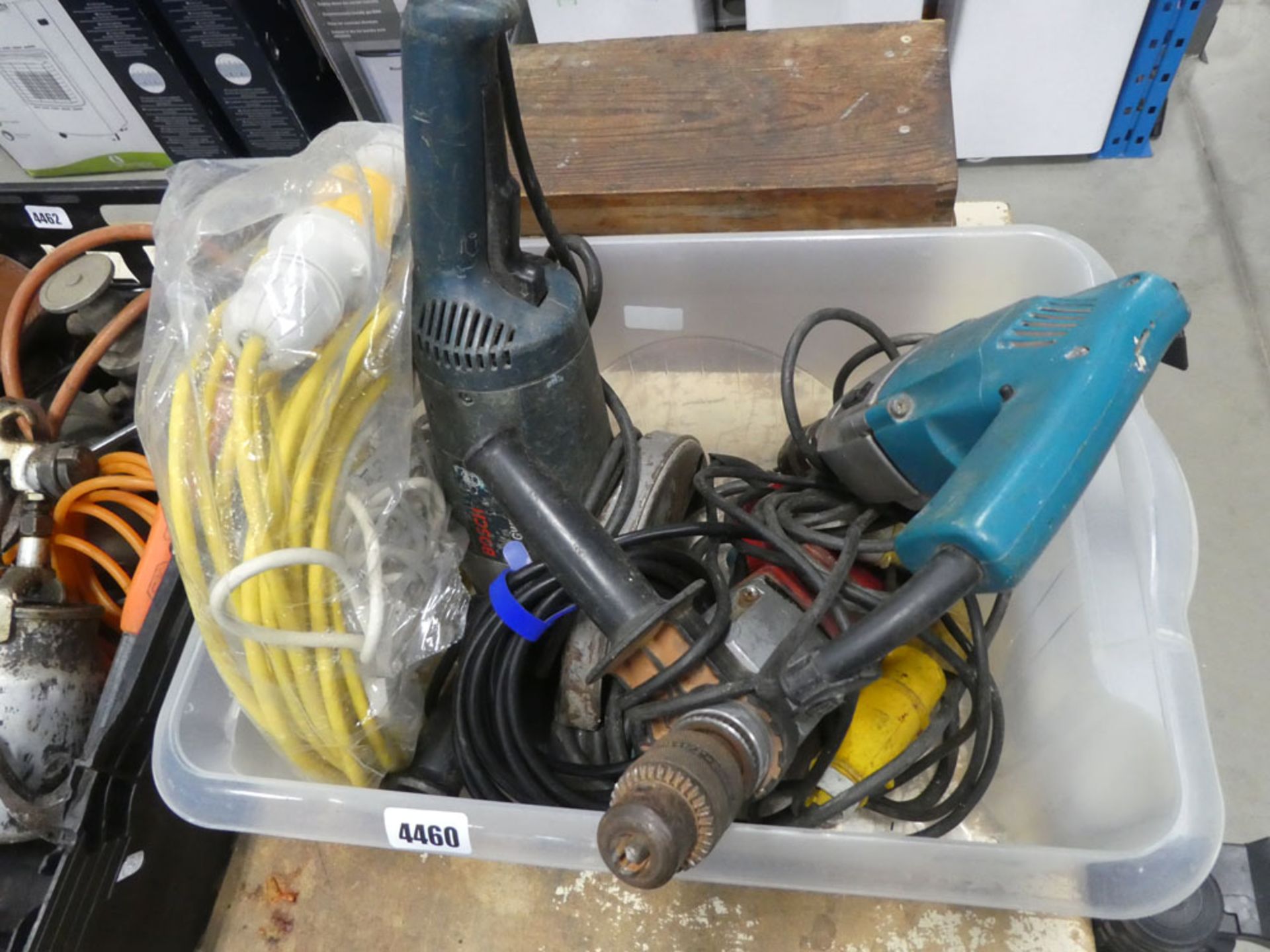 Box containing drills, circular saw, 110v cable etc