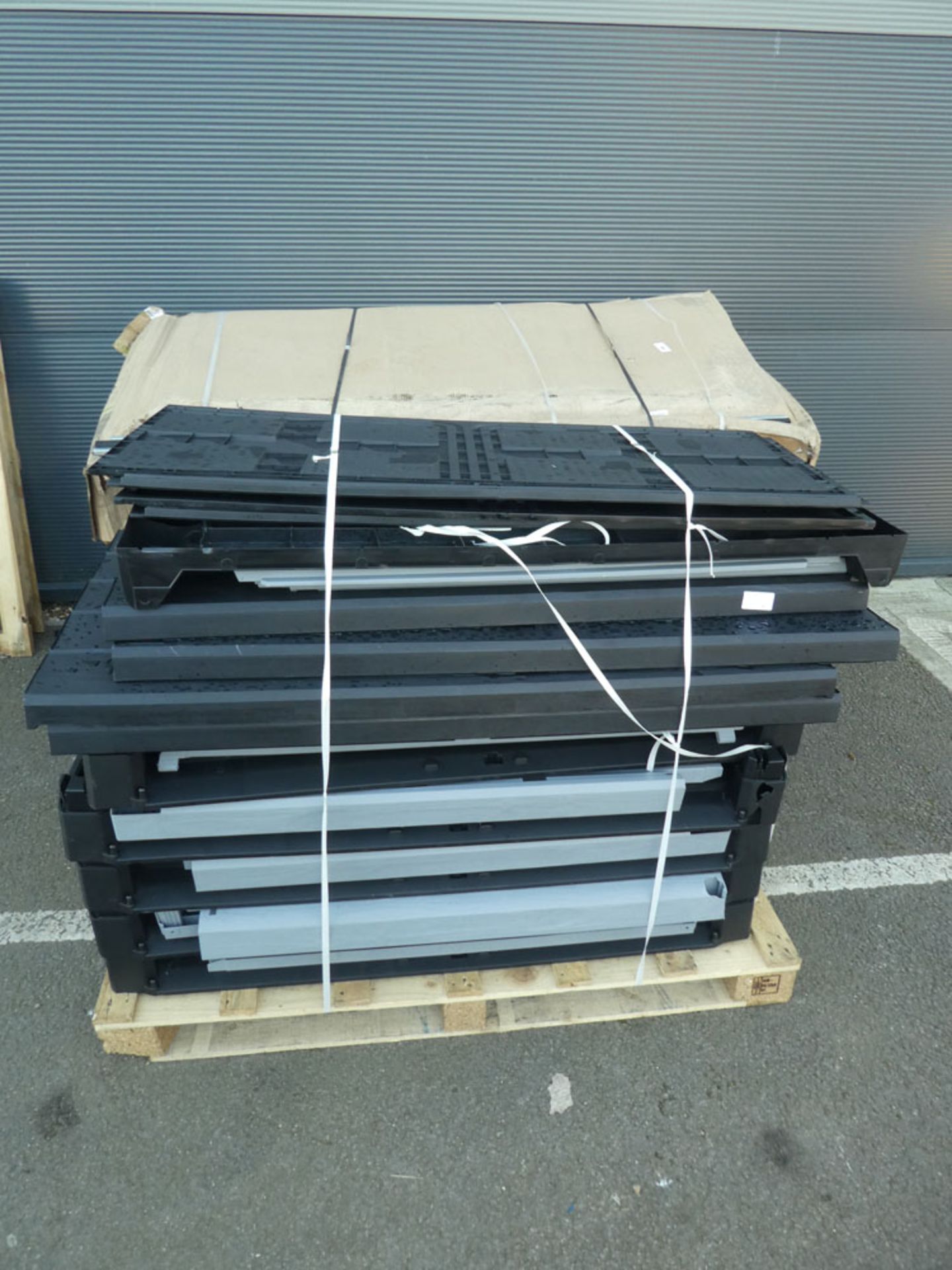 2 pallets containing flatpack shed parts