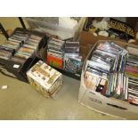 4 boxes containing vinyl records and CD's