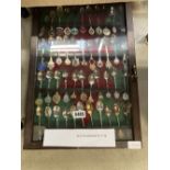 Display cabinet with souvenir spoons