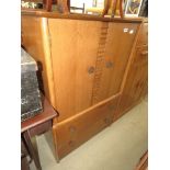 Oak finished double door cabinet with two drawers under