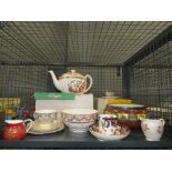 Cage containing a floral-patterned Spode teapot, painted fruitbowl, cups & saucers plus milk jugs
