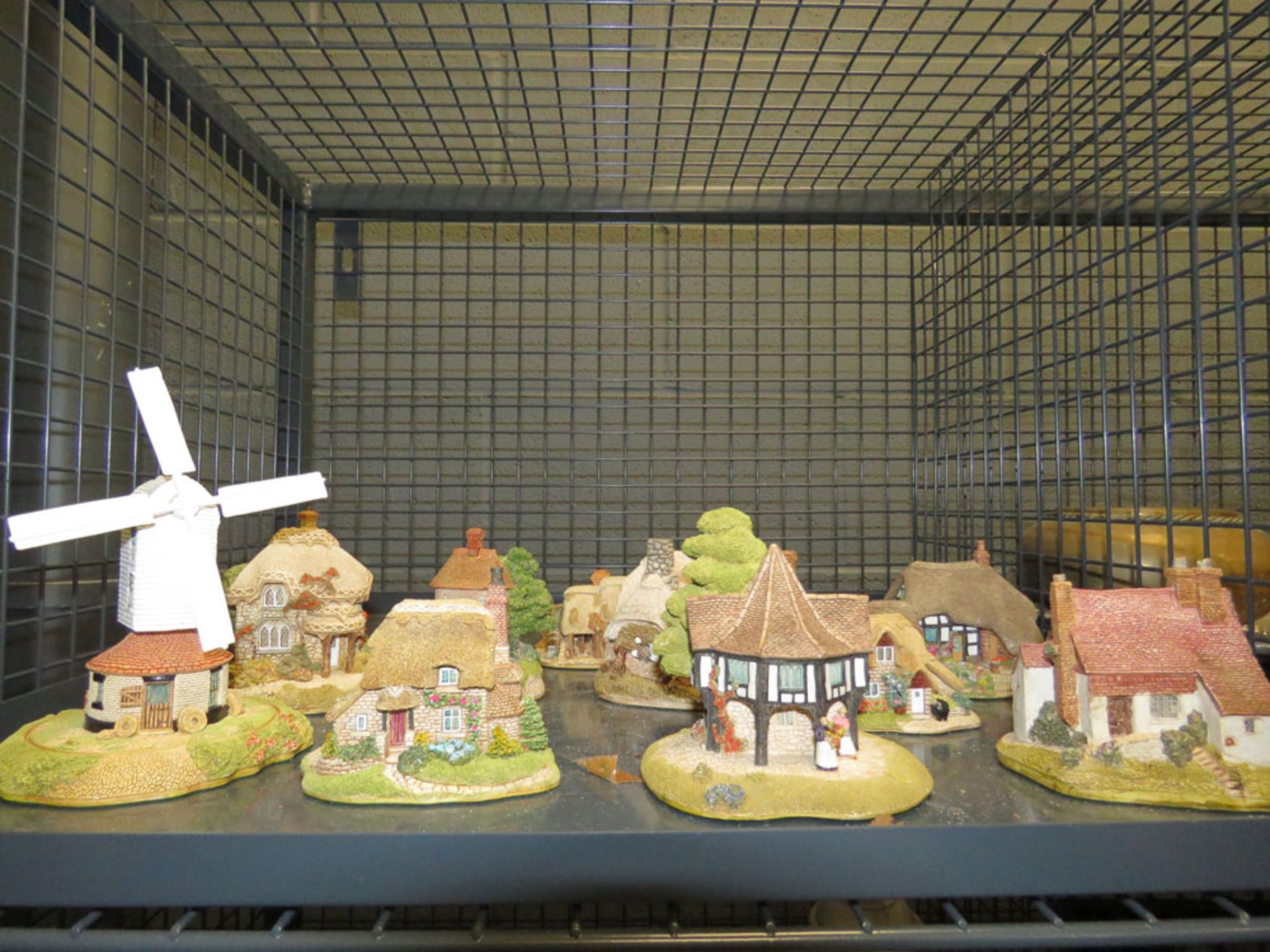 Cage containing a quantity of Lilliput Lane cottages