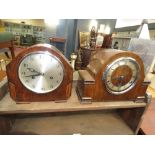 Two dome topped mantel clocks with oak and walnut cases