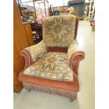 Armchair upholstered in brown fabric