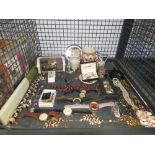 Cage containing wristwatches, costume jewellery, and jugs