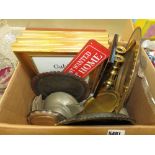 Box containing picture frames, pewter teapot, silver plated dish, brass candlesticks and trays