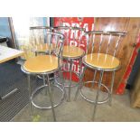 Four chrome and beech bar stools