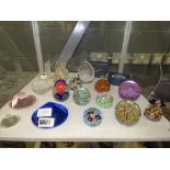 Shelf with large quantity of glass paperweights