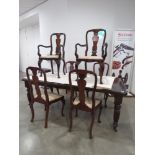 Extending dining table with 6 Queen Anne style chairs to inc. 2 carvers