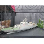 Cage containing a model gunboat