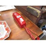 Red molded plastic telephone