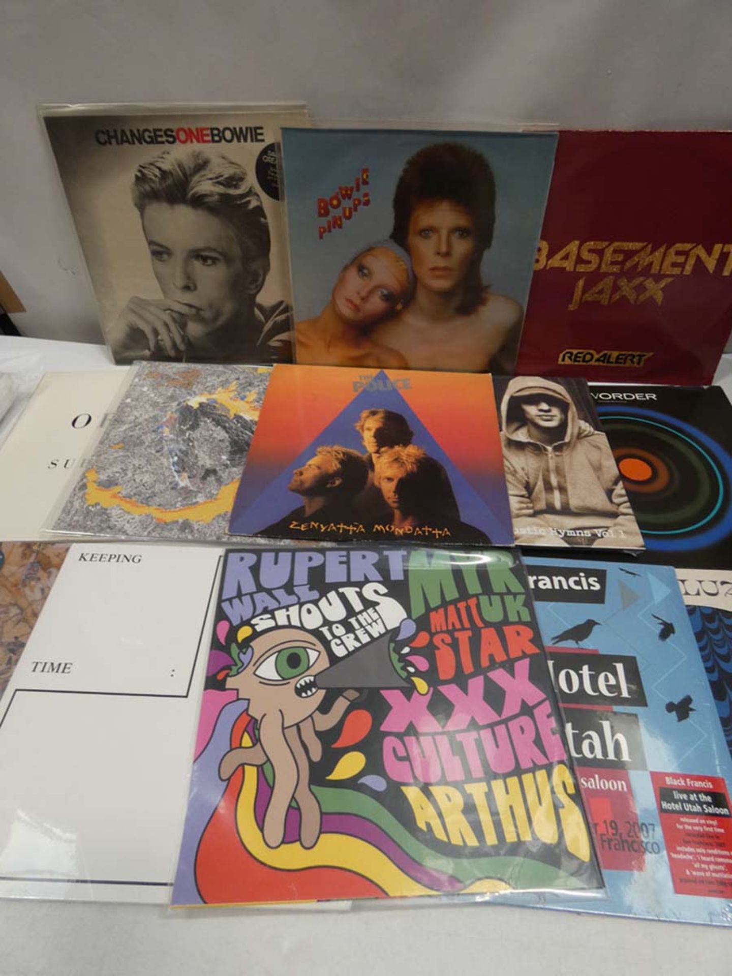 Box containing LP and 45 records to include David Bowie, Basement Jaxx, The Police, New Order and